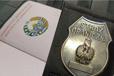 Otwarty paszport obywatela uzbekistanu a na nim odznaka funkcjonariusza sg